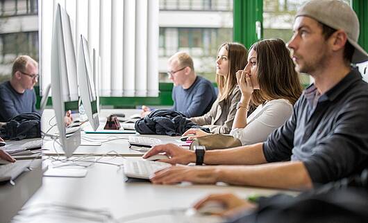 Image: Students working in front of a computer
