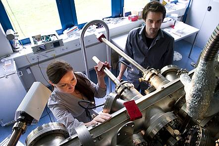 Image: Students adjusting their research project.